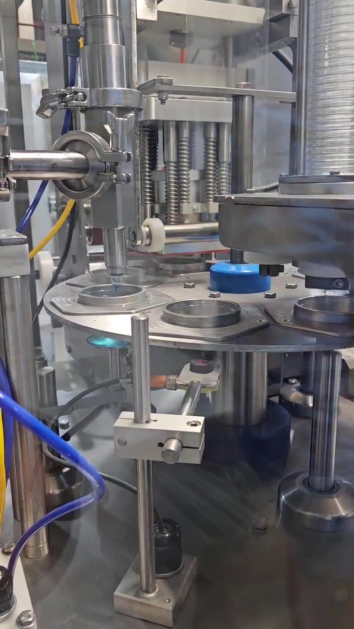 Cups being sealed with lidding film